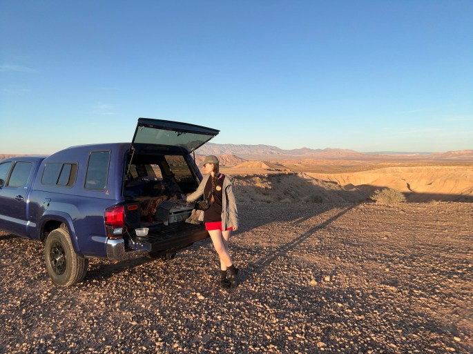 Toyota Tacoma with camper setup parked on open BLM land at Poverty Flats near Valley of Fire State Park