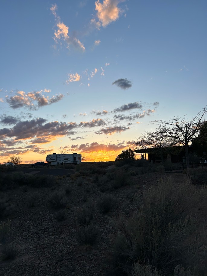 Glowing golden sunset over the flat Arizona desert at Homolovi State Park
